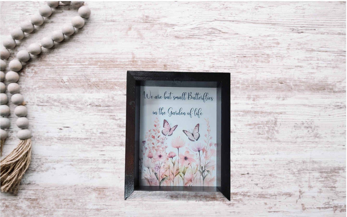 Butterflies in Garden of Life Sign